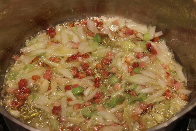 sauteeing the spring onion with the pancetta