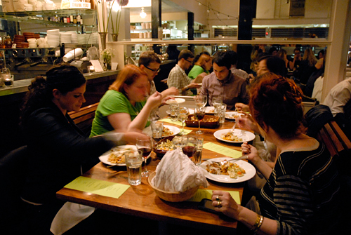 Guests feast at The Perennial Plates Harvest dinner at Tartine Bakery in San Francisco. Photo by Wendy Goodfriend