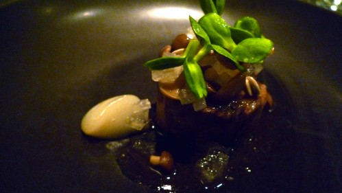 beef braised in pear, beech mushroom, sunflower seeds and leaves