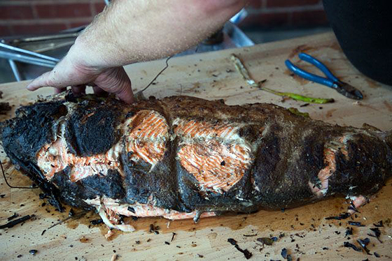 The king salmon is removed from the grill while rare.