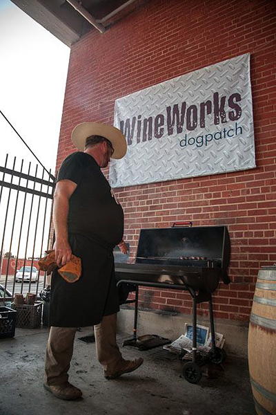 John Fink of The Whole Beast prepares his grill at Dogpatch Wine Works 