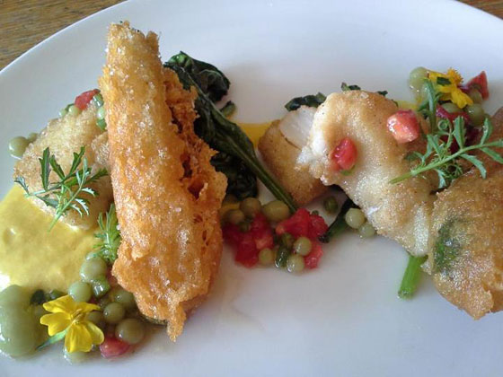 halibut cheeks dusted in masa, saffron and zucchini bisque, castelvetrano olive caviar and heirloom tomato relish, bloomsdale spinach, fried zucchini sticks and lemon marigold flowers  