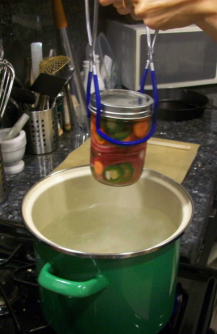 Boiling the jars helps to create a tight seal and kill any lurking bacteria. Photo: Joseph Wrye