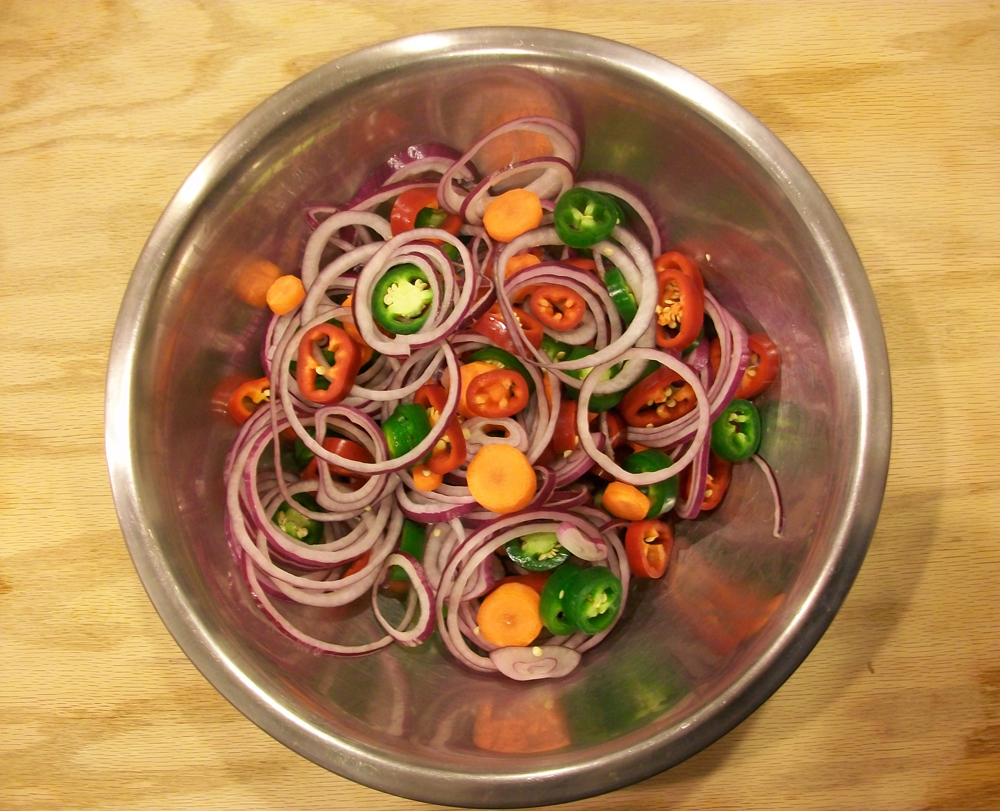 Red and green jalapenos, red onion and carrot are ready to be jarred and pickled. Photo: Joseph Wrye