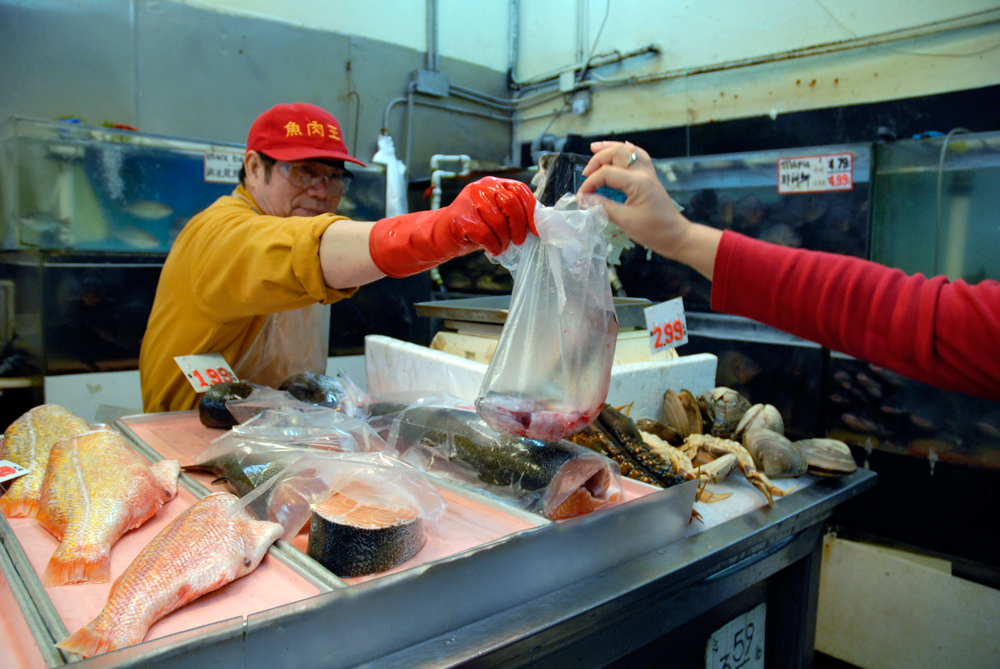Buying Fish at E&F Market. Photo: Wendy Goodfriend