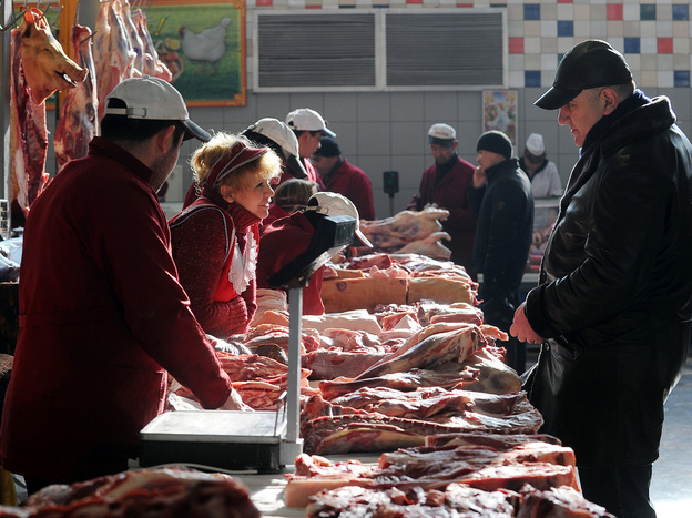 A man buys meat at a butcher's stand in Moscow's Dorogomilovsky market in 2011. On Monday, Russia began blocking U.S. meat imports until those imports are ractopamine-free.