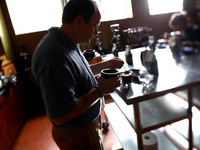Mark Stell of Portland Roasting samples coffee from his Guatemalan grower. Photo: David Gilkey/NPR