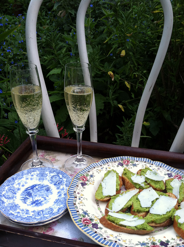 Finished fava bean crostini with champagne