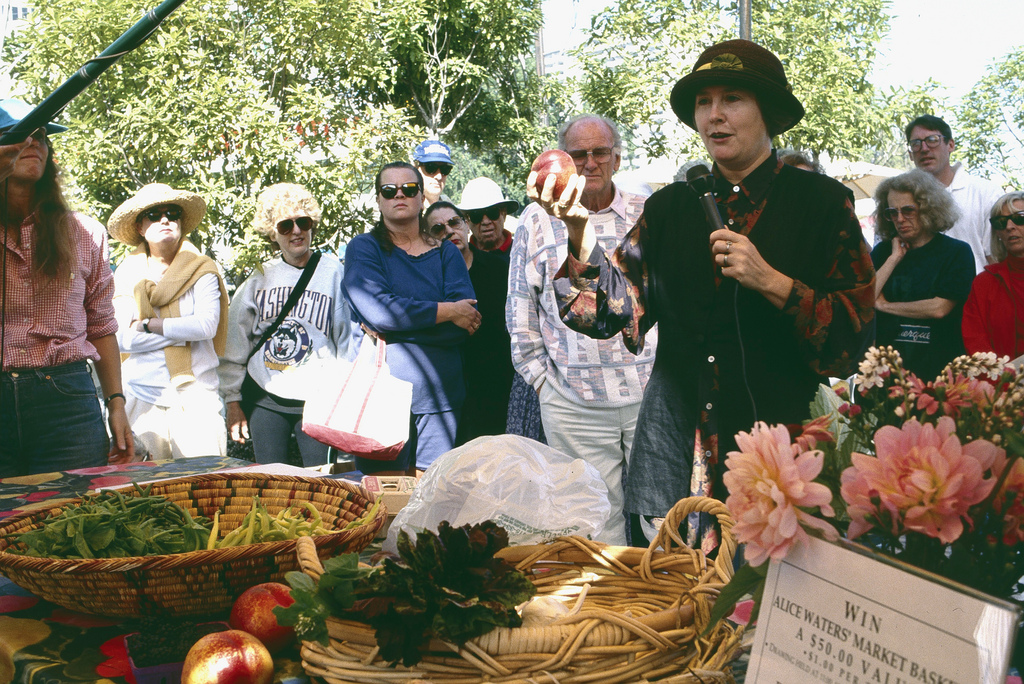  Archival photo of Alice Waters at the Ferry Plaza Farmers Market. Photo courtesy of CUESA