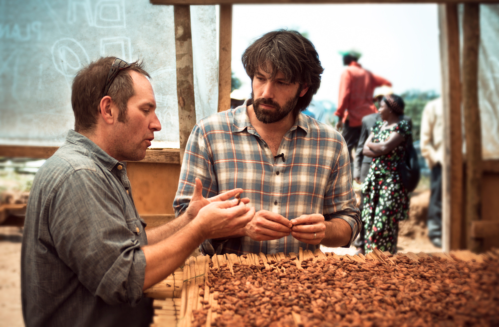 Theo Chocolate CEO Joe Whinney and actor and Academy Award-winning movie director Ben Affleck inspect cocoa beans in eastern Congo. Photo: Piet Suess