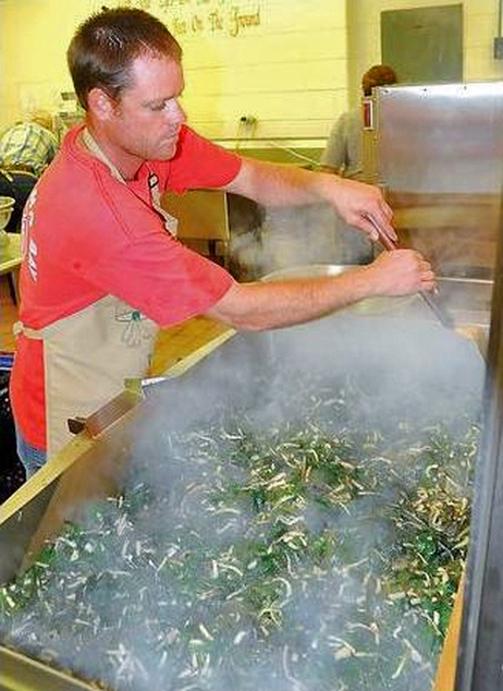 Apprentice cook Ryan McClung sautées ramps for the 2012 ramp festival in Richwood, West Va. Photo: F. Brian Ferguson/The Register-Herald