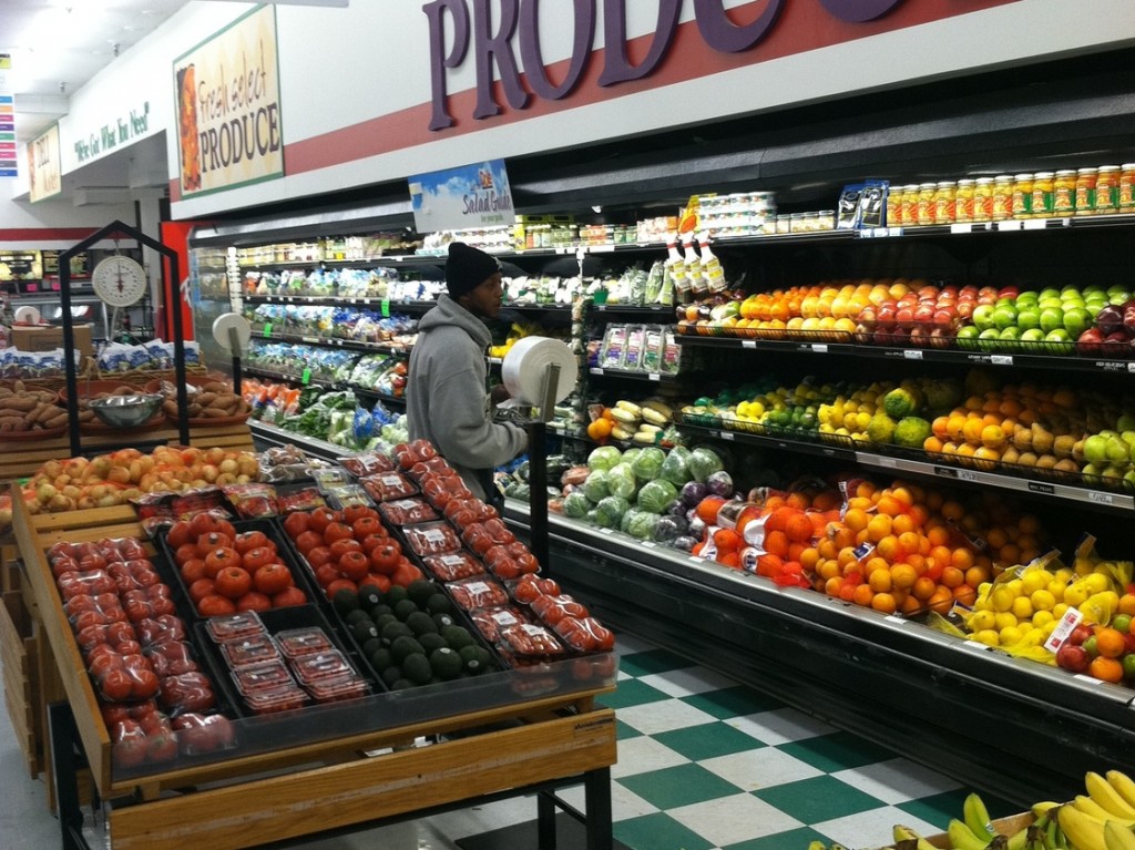 A customer in the produce section at Metro Foodland, one of the Detroit grocery stores participating in a healthy food incentive program for people with SNAP benefits. The store will add a section of specially marked local produce as part of the program. Photo: Courtesy of the Fair Food Network