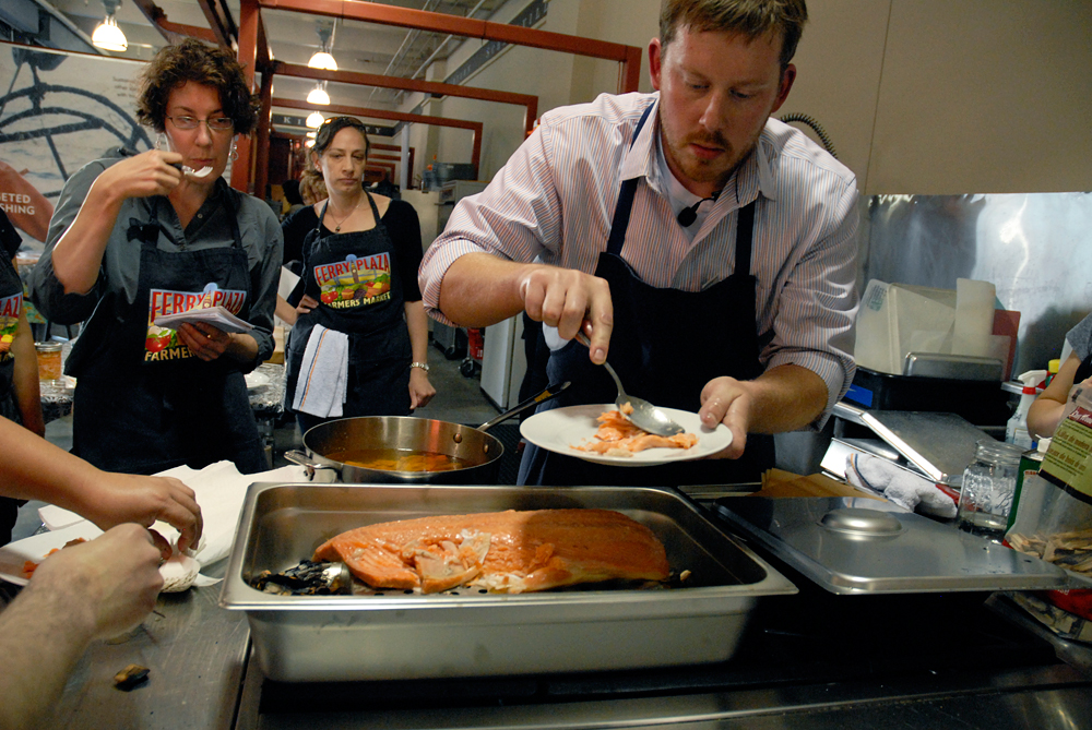 Chef Neil Davidson serves up the smoked salmon to enthusiastic students. Photo: Wendy Goodfriend