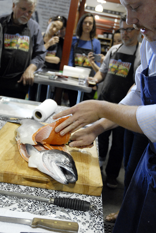 Chef Neil Davidson demonstrates filleting the king salmon. Photo: Wendy Goodfriend