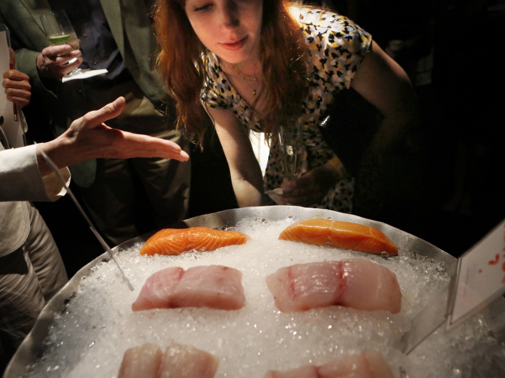 Jessica McConnell, 26, of Silver Spring, Md., tries to identify various species of fish — halibut, red snapper and salmon — that are commonly mislabeled. Photo: Heather Rousseau/NPR
