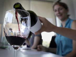 Swigging for science: A hint of oak, our winetasting newbies learned, is more common in reds than whites. It's a marker for expense in both. Photo: Heather Rousseau/NPR
