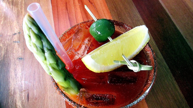 Rimmed with chile powder and salt, the bloody mary comes with a spear of picked asparagus, olive and lemon. Photo: Jonathan Darr