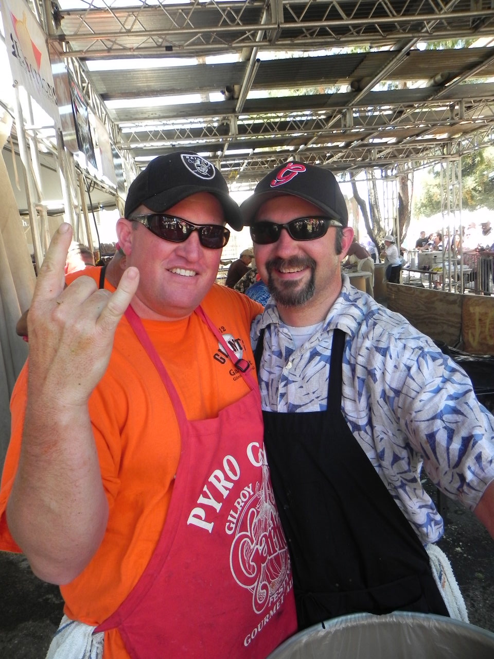 Rich Janisch (left) and Scott Povio (right) of Gilroy have been volunteering at the festival for years. Neither are professional chefs. They just love to cook, especially with garlic. Photo: Gina Scialabba