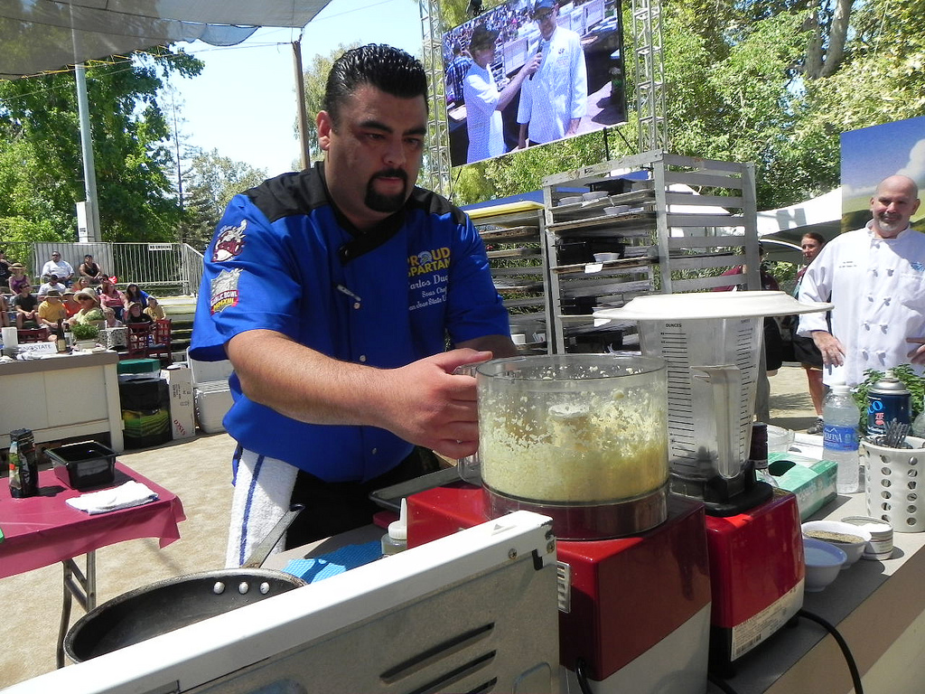 Sous Chef Carlos Duque processes garlic for the “Surf” and “Turf” creation. Photo: Gina Scialabba