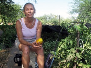 Food bank client Jamie Senik takes a break near her garden plot sponsored by the Community Food Bank of Southern Arizona. She grows food for herself and her diabetic mother. Photo: Pam Fessler/NPR