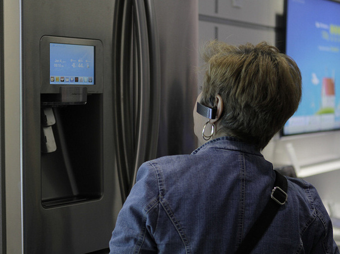 A woman checks out a smart refrigerator at a consumer electronics show in 2012. Photo: Samsung
