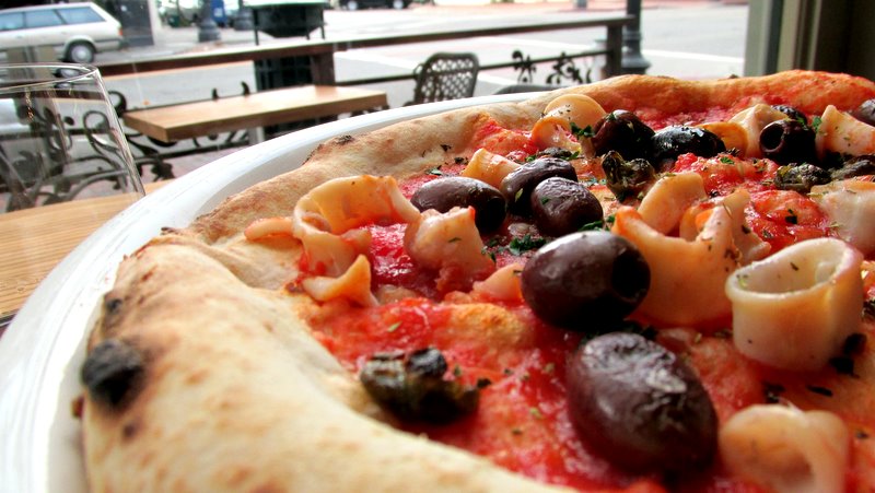 Pizza with calamari, olives, capers and garlic. Photo Jonathan Darr
