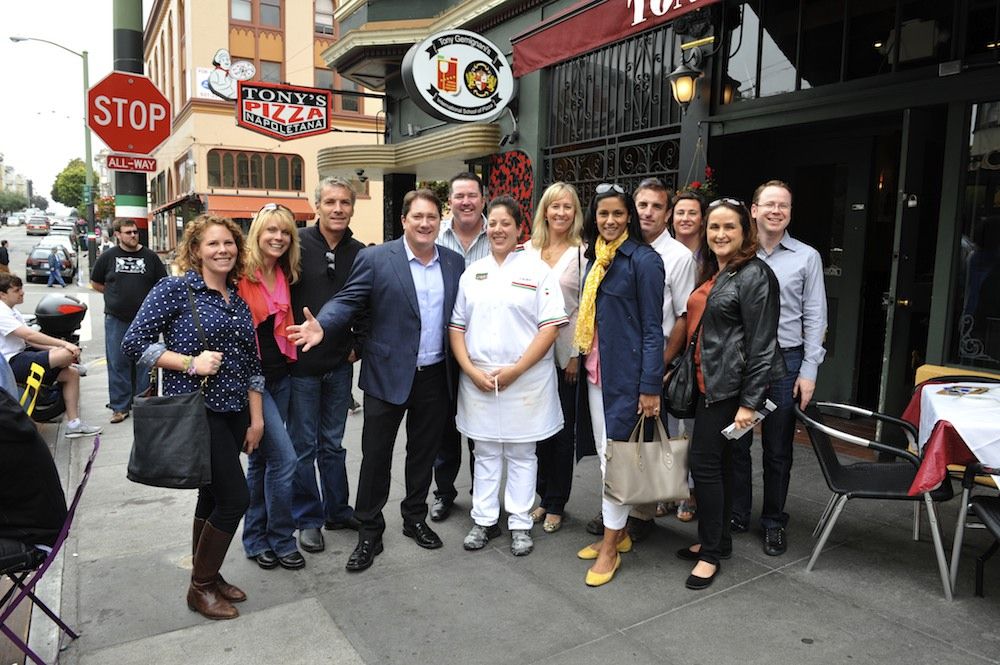 Liam Mayclem surrounded by tour guests at Tony's Pizza Napoletana in North Beach Photo: Rick Camargo