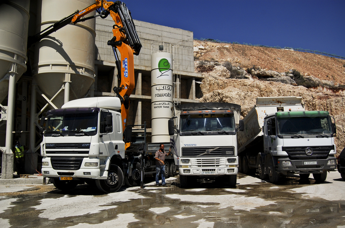 Cement mixers in Rawabi, a planned Palestinian town in the West Bank, about 25 miles north of Jerusalem. Photo: Emily Harris/NPR