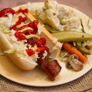 Spiral dog with homemade sauerkraut, pickles, and dilly potato salad