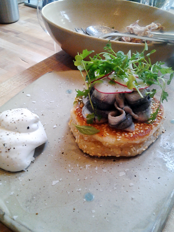 State Bird's sesame pancake with pickled anchovy and creme fraiche. Photo: Mary Ladd