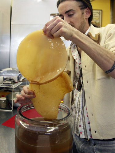 The SCOBY: Bill Bond, of Bucha Bill Raw Kombucha, shows off the "symbiotic colony of bacteria and yeast" in his fermented tea. The microorganisms of the SCOBY convert the sweetened tea into the fizzy elixir. Photo: Peggy Turbett/The Plain Dealer /Landov