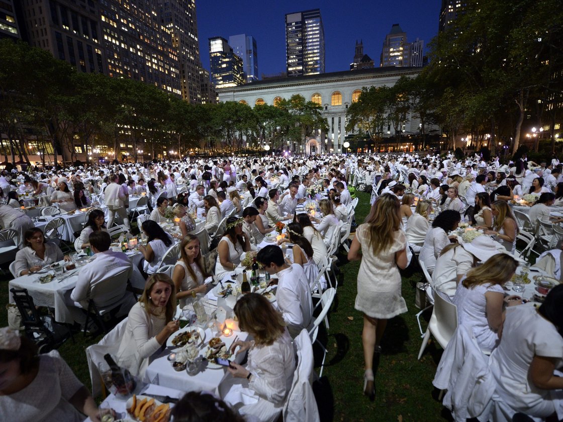 Some 4,000 guests, all dressed in white, showed up for the secret dinner party in New York City's Bryant Park. Photo: Timothy Clary/AFP/Getty Images