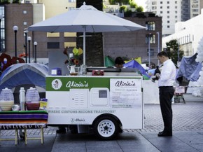Villanueva sells tamales from her cart at a Justin Herman Plaza in San Francisco. Villanueva bought her cart for $1 thanks to the generosity of , a maker of high-end mobile carts and trailers. Photo: Courtesy of La Cocina