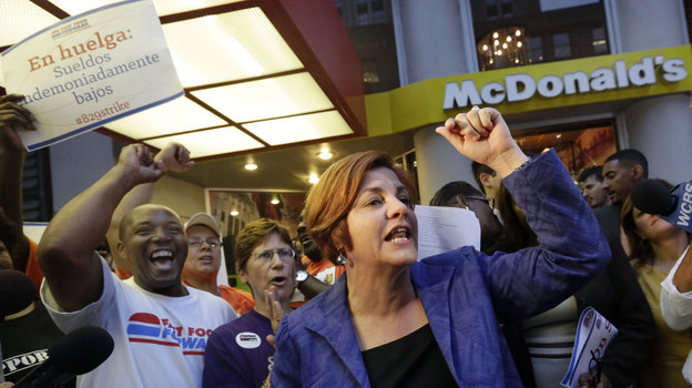 New York City Council speaker and then-mayoral candidate Christine Quinn speaks at a fast-food workers' protest outside a McDonald's in New York in August. A nationwide movement is calling for raising the minimum hourly wage for fast-food workers to $15. Photo: Richard Drew/AP
