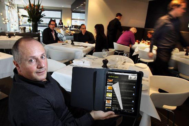 A restaurant customer tries out the Aptito app on a digital menu. Photo: Courtesy of Aptito