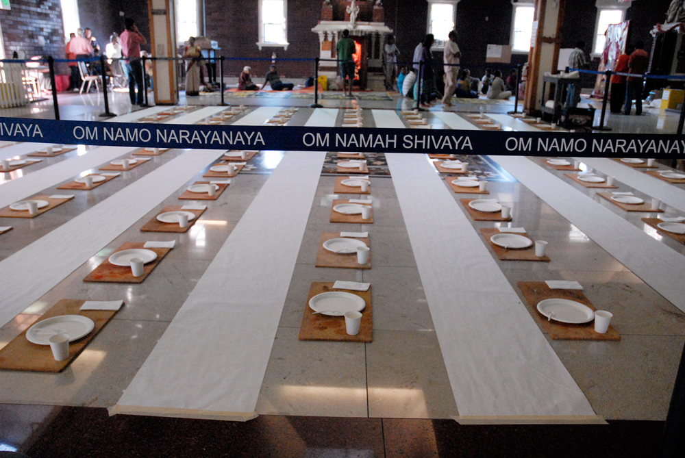 Om Namah Shivaya barricade enclosing place settings to celebrate Ganesha. Photo: Wendy Goodfriend