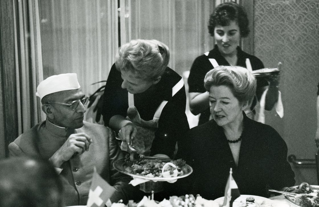 Margrith Hiltl (seat at right) brought Eastern influences to Hiltl's menu after traveling to India in the early 1950s. Here, she's seen dining with Indian Prime Minister Morarji Desai. Photo: Courtesy Hiltl