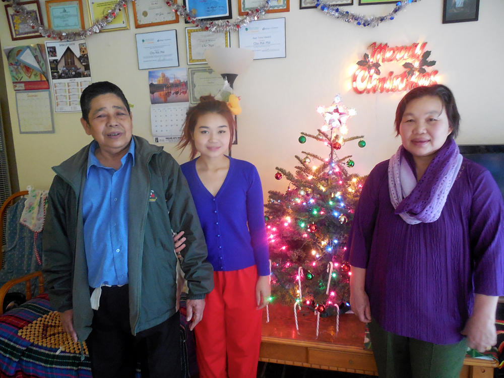 Cho Mei and parents: Cho Mei and her parents bought their first Christmas tree this year. Cho Mei says she’s even doing a Secret Santa with her family – something she learned from her Burmese church group in Oakland. Photo: Shuka Kalantari