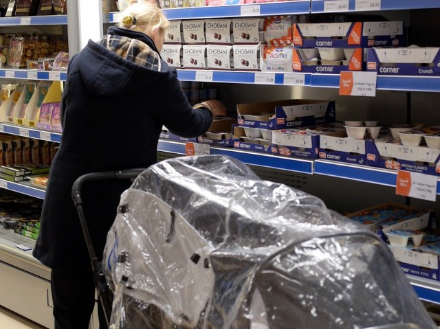 A customer scans the shelves at Community Shop, the U.K.'s first "social supermarket." The discount grocery stores are growing in popularity across Europe and are open exclusively to those in need. Photo: Courtesy of Community Shop