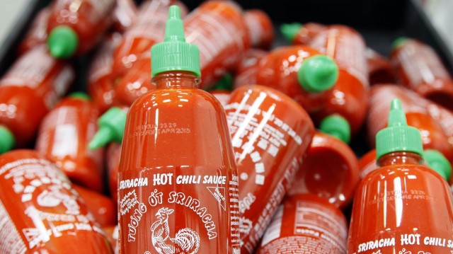 Can't get enough of Sriracha? Now it can fill your belly and your screens. Photo: Nick Ut/AP