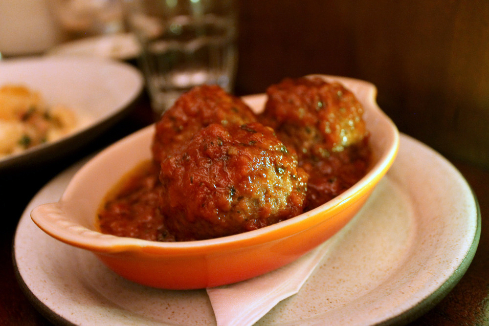 The "secret" meatballs are made from a trio of beef, pork, and cured guanciale. Photo: Kate Williams
