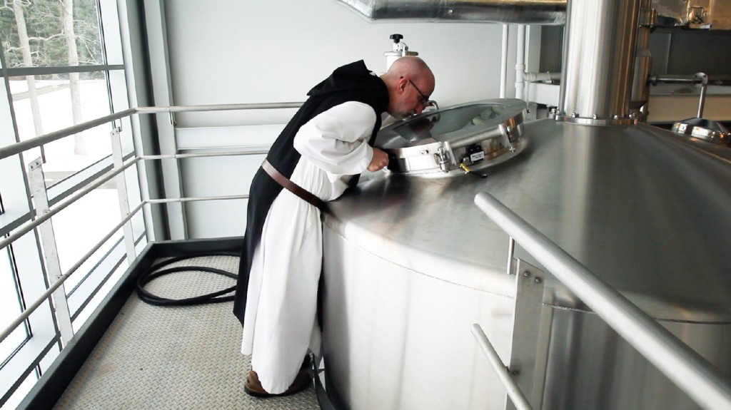 A monk at St. Joseph's Abbey inspects the boil. Photo: Nick Hiller/The Spencer Brewery