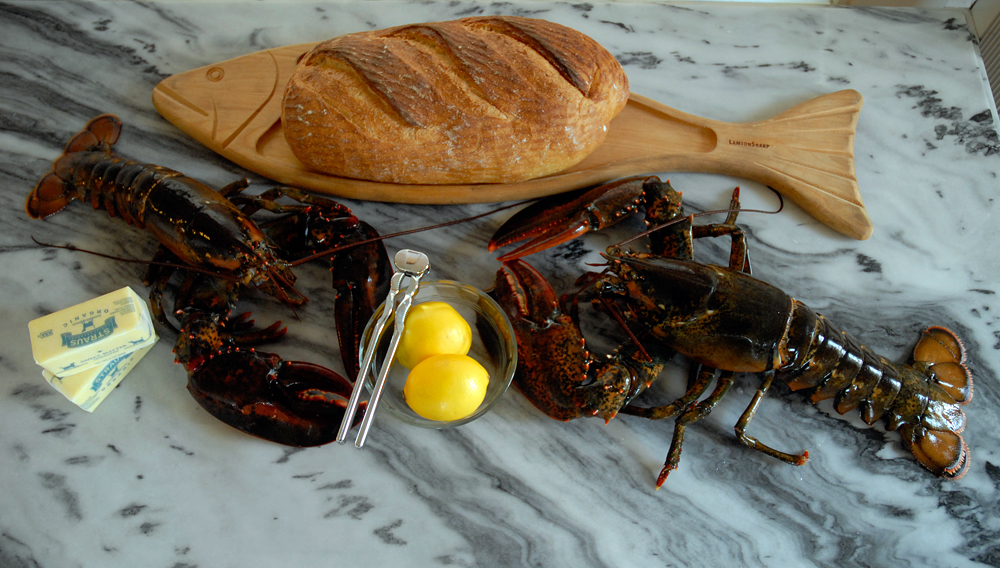 Live lobsters with Meyer lemons, butter and sourdough loaf. Photo: Wendy Goodfriend