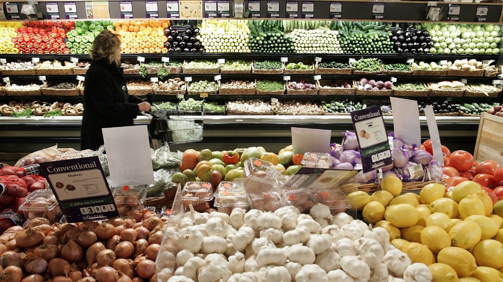 A woman shops in the produce section at Whole Foods in New York City. The company recently announced it would prohibit produce farmed using biosolids in its stores. Photo: Stephen Chernin/Getty Images