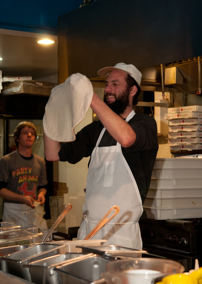 Dough-slinging in the open kitchen. Photo: Naomi Fiss