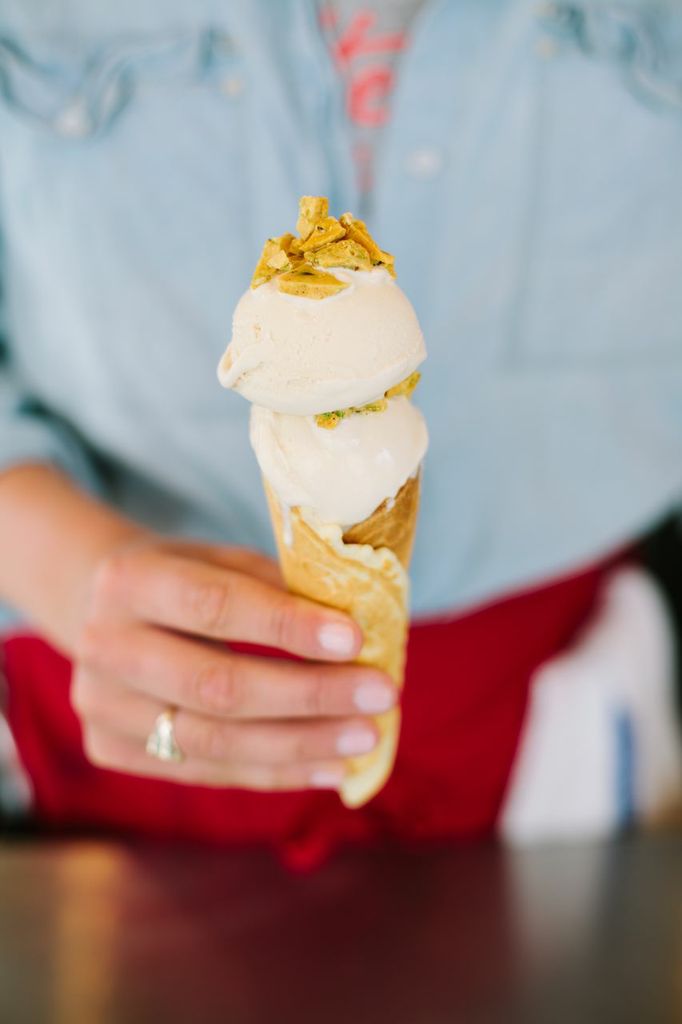 Smitten Ice Cream cone topped with housemade pistachio brittle. Photo courtesy of Nathan Michael