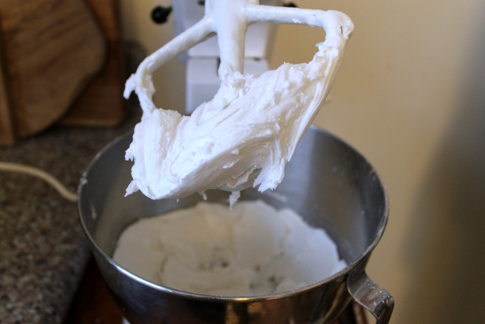 Beat confectioner’s sugar into the gelatin and soda mixture until it becomes a thick dough. Photo: Kate Williams