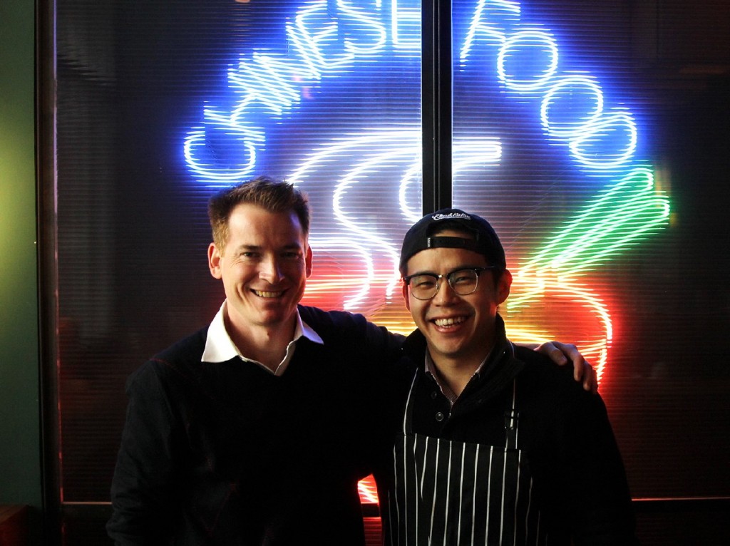 American entrepreneurs David Rossi (left) and Fung Lam co-own Fortune Cookie, a new Shanghai restaurant that serves Chinatown cuisine. (Frank Langfitt/NPR)