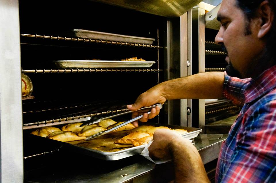 "The empanada guy" makes empanadas at Kitchener Oakland and thought up the idea for the take-out windows. Photo: Courtesy of Kitchener 
