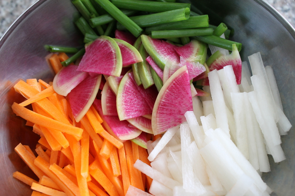 To add variety to my kimchi, I’ve added carrots, daikon radish, watermelon radish, and scallion greens. Photo: Kate Williams